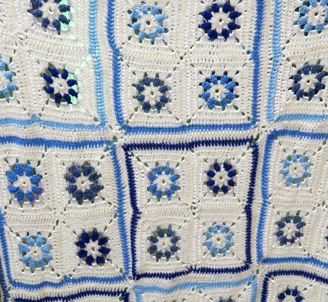 baby blanket in shades of blue and cream