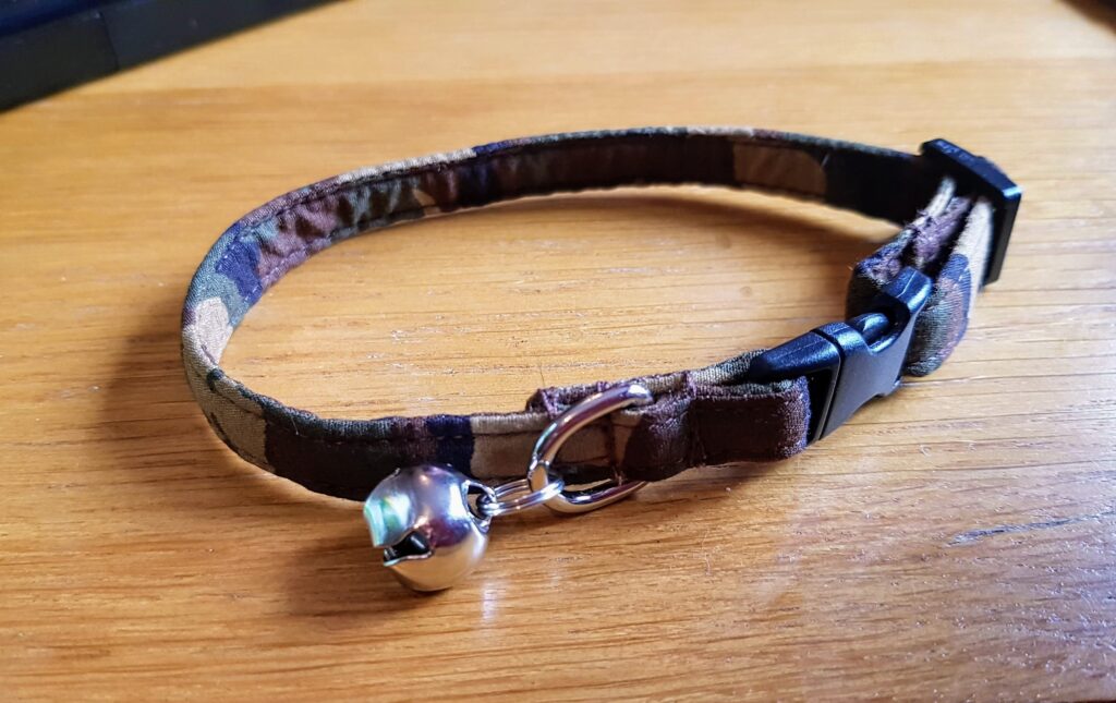 camo cat collar with a little bell.