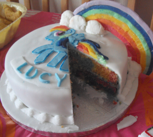 The My Little Pony Cake with a slice cut out so you can see inside