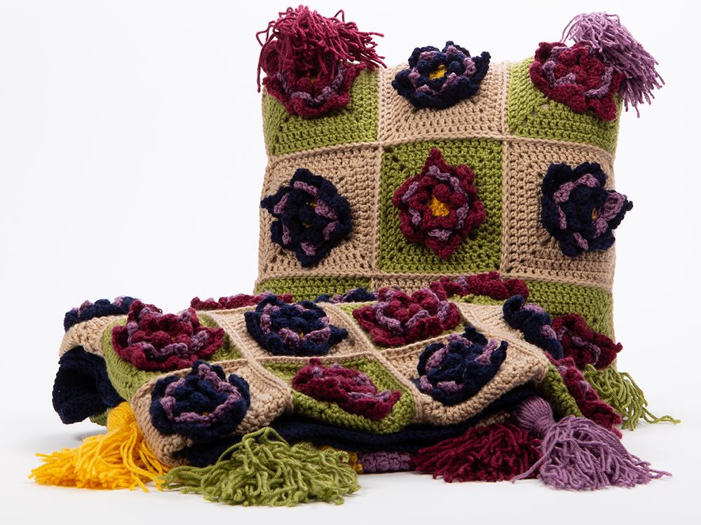 cushion and throw covered with flowers