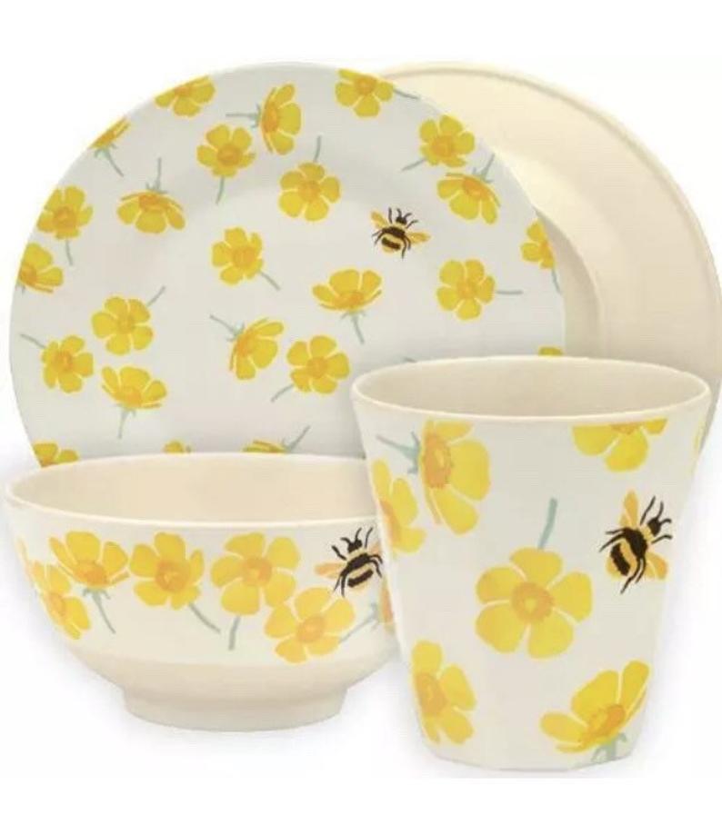 plate, bowl and beaker set with yellow flowers and bumble bees.