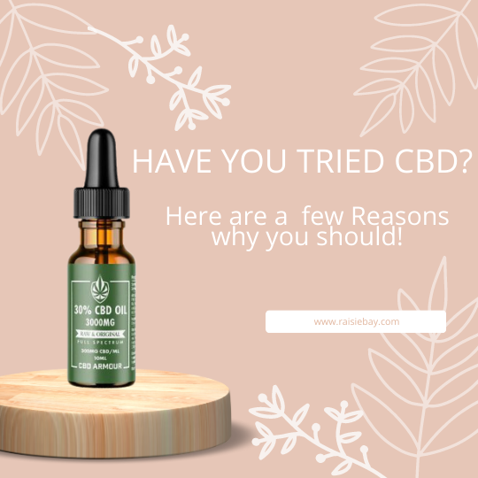 Have you tried CBD? Bottle of CBD oil on a wooden plinth with text and leaves
