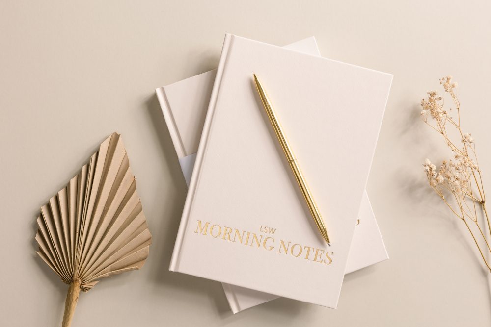 Morning Notes, notebook, hardback shown with a gold pen a paper leaf and dried flowers.