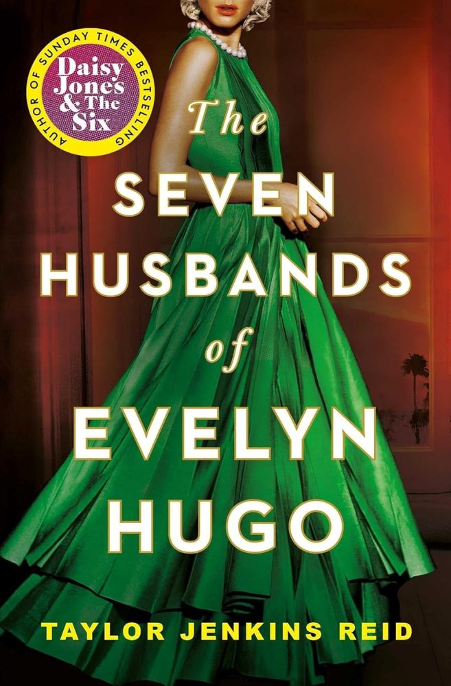 The Seven Husbands of Evelyn Hugo book cover. An elegant actress in an emerald green dress with just a glimpse of her face and blonde hair, against a red curtain background