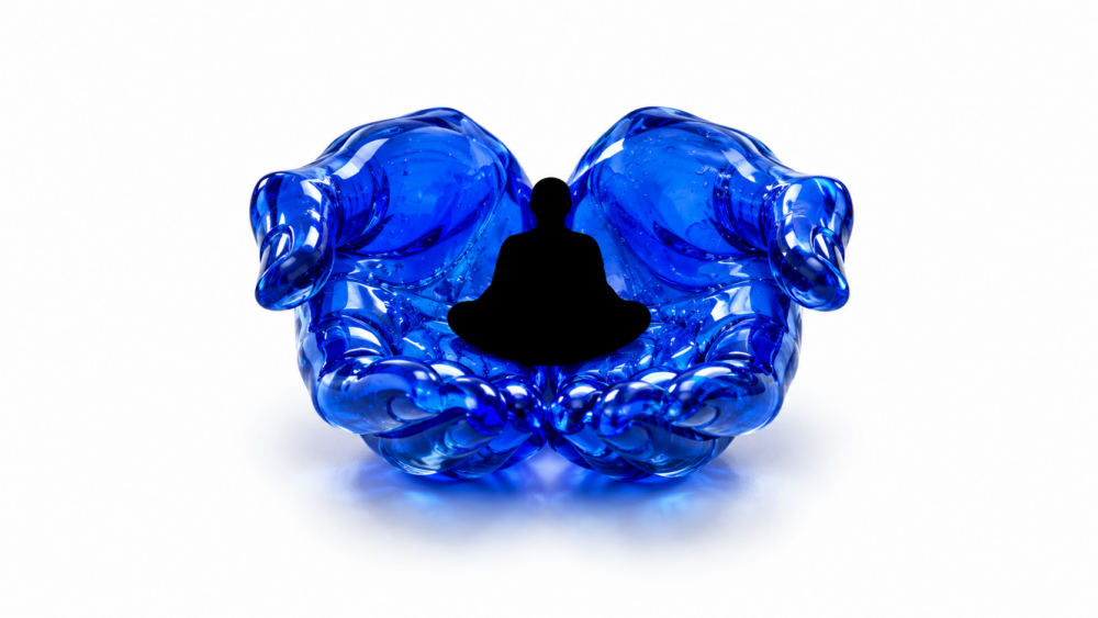 A pair of glass hands holding a meditating figure
